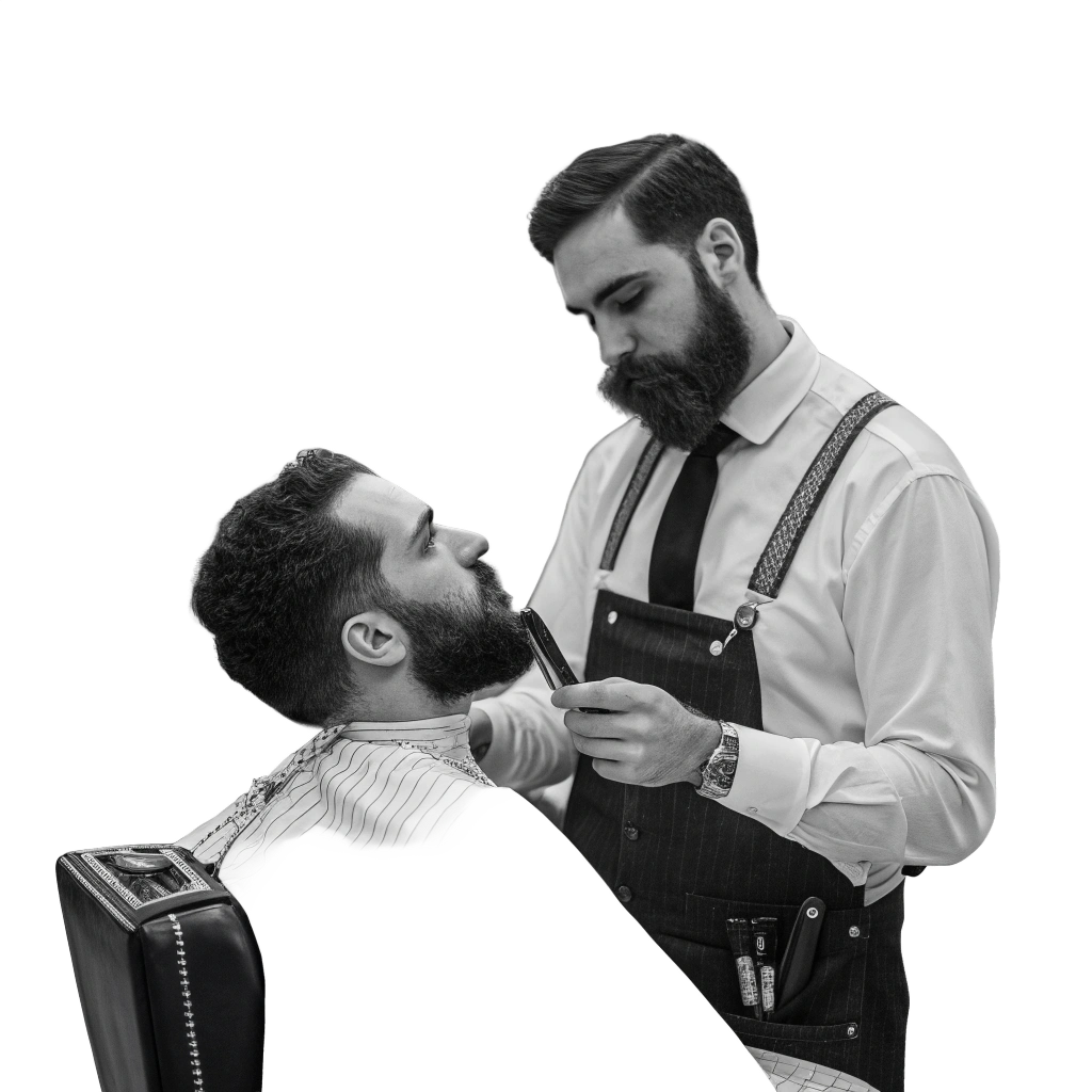 A black and white studio portrait of a bearded barber in a pinstripe apron and suspenders using a straight razor to detail the beard of a client seated in a barber chair.